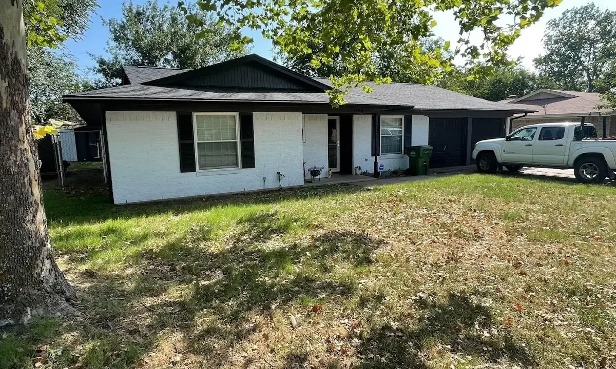 Professional roofing crew working on a residential roof in Kalifornsky